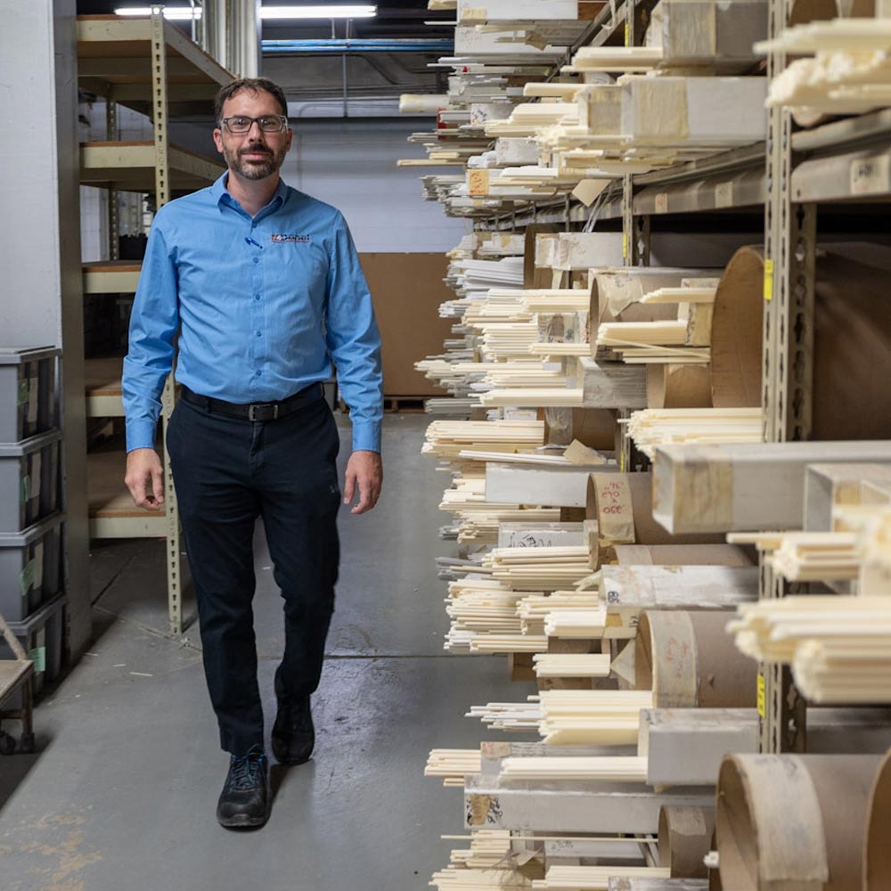 Tony Finoli walking near ceramic rods