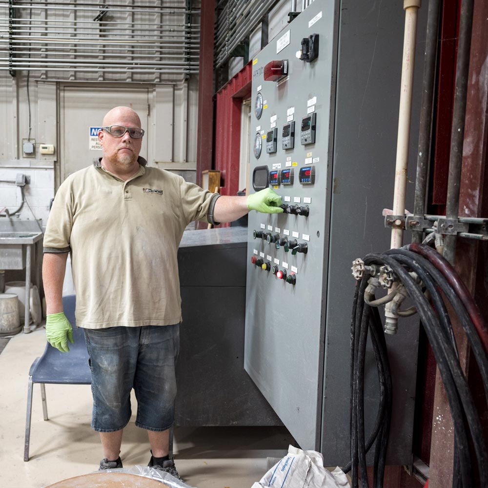 McDanel Ceramics engineer near control panel